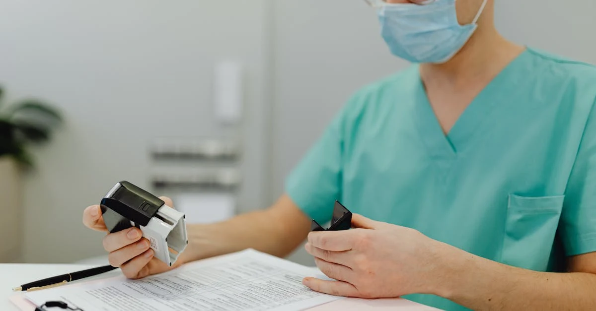 Healthcare professional in scrubs stamping inpatient medical coding form at desk with clipboard and stethoscope nearby.