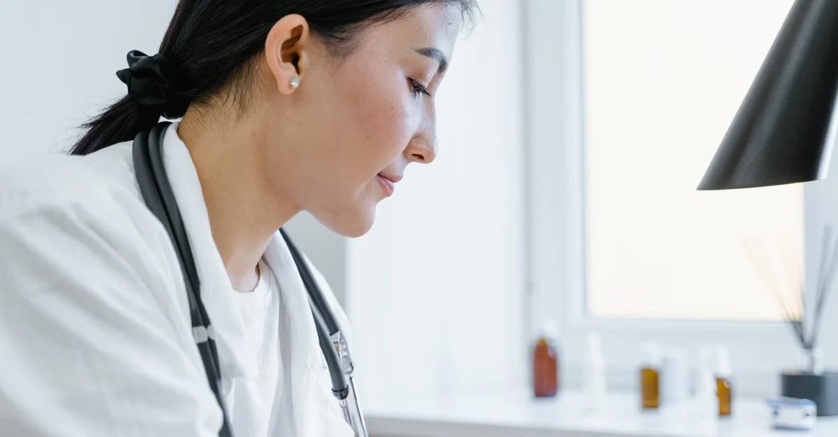 Healthcare professional using productivity calculator on computer to streamline after-hours documentation efficiently.